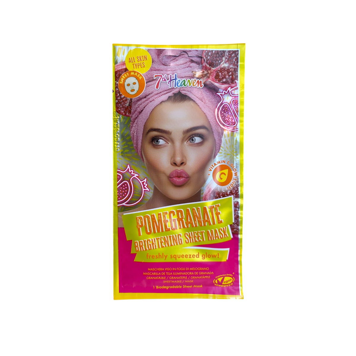Mascarilla facial de tejido iluminadora de granada con vitamina C 7th Heaven, sobre rosa y amarillo, biodegradable y apta para todo tipo de pieles.